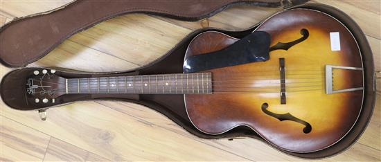 A Harmony USA Silvertone guitar H710 model , cased 104cm